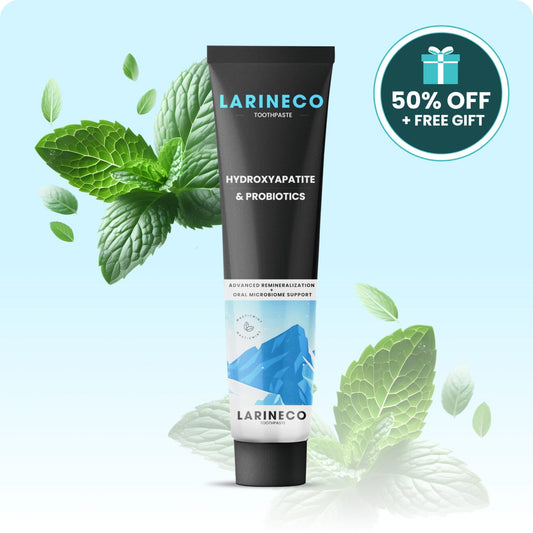 Toothpaste tube with mint leaves and a gift badge.